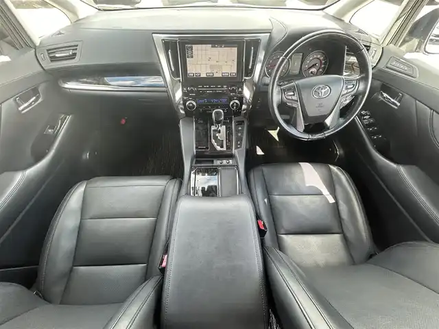 トヨタ ヴェルファイア Z Gエディション 岡山県 2019(令1)年 9.3万km ホワイトパールクリスタルシャイン 登録時走行距離92/577km/純正メーカーオプション10インチナビ/（AM/FM/DISC/TV/Bluetooth）/純正12.1型フリップダウンモニター/ツインムーンルーフ/JBLプレミアムサウンド/トヨタセーフティセンス/・プリクラッシュセーフティ/・レーンディパーチャーアラート/・アダプティブハイビーム/・レーダークルーズコントロール/パノラミックビューモニター/パーキングアシスト/3眼LEDヘッドランプ/デジタルインナーミラー/ブラインドスポットモニター/両側パワースライドドア/スペアキー×1/パワーバックドア/パワーシート(全席)/シートヒーター(全席)/シートベンチレーション(全席)/ステアリングヒーター/ビルトインETC2.0/前後ドライブレコーダー/電動パーキングブレーキ/オートブレーキホールド/プッシュスタート/スマートキー