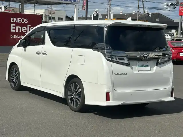 トヨタ ヴェルファイア Z Gエディション 岡山県 2019(令1)年 9.3万km ホワイトパールクリスタルシャイン 登録時走行距離92/577km/純正メーカーオプション10インチナビ/（AM/FM/DISC/TV/Bluetooth）/純正12.1型フリップダウンモニター/ツインムーンルーフ/JBLプレミアムサウンド/トヨタセーフティセンス/・プリクラッシュセーフティ/・レーンディパーチャーアラート/・アダプティブハイビーム/・レーダークルーズコントロール/パノラミックビューモニター/パーキングアシスト/3眼LEDヘッドランプ/デジタルインナーミラー/ブラインドスポットモニター/両側パワースライドドア/スペアキー×1/パワーバックドア/パワーシート(全席)/シートヒーター(全席)/シートベンチレーション(全席)/ステアリングヒーター/ビルトインETC2.0/前後ドライブレコーダー/電動パーキングブレーキ/オートブレーキホールド/プッシュスタート/スマートキー