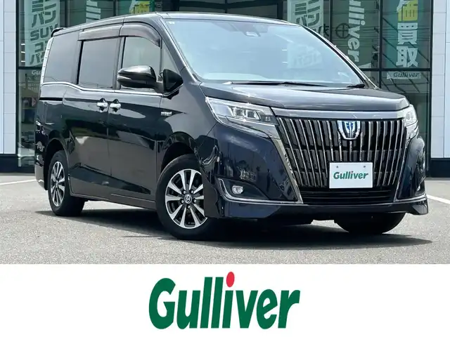 トヨタ エスクァイア ハイブリッド Gi プレミアムパッケージ ブラックテーラード 岡山県 2019(令1)年 9.6万km スパークリングブラックパールクリスタルシャイン 登録時走行距離95162km/社外10インチナビ/フルセグTV(AM.FM.CD.DVD.TV.BT)/両側パワースライドドア/バックカメラ/ETC/ドライブレコーダー/シートヒーター/クリアランスソナー/衝突軽減ブレーキ/クルーズコントロール/レーンキープアシスト/オートマチックハイビーム/アイドリングストップ/15インチ純正AW/純正フロアマット