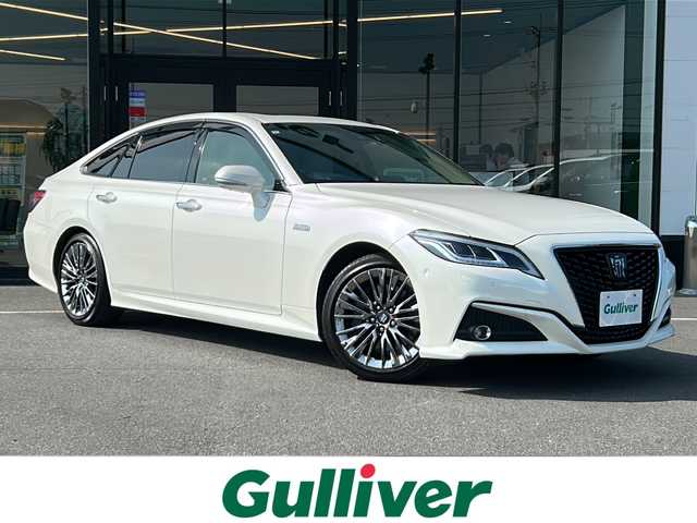 トヨタ クラウン ハイブリッド G－エグゼクティブ 茨城県 2019(令1)年 1.8万km ホワイトパールクリスタルシャイン 横滑り防止装置/コーナーセンサー/レーンキープアシスト/盗難防止装置/オートライト/オートマチックハイビーム/LEDヘッドライト/カーテンエアバッグ/Bluetooth/USB入力端子/ETC2.0/全方位カメラ/フルセグTV/純正SDナビ/サンルーフ/MTモード付AT/パーキングアシスト/スマートキー/冷房AAC/クルーズコントロール/ドライブレコーダー/純正フロアマット/パワーシート/レザーシート/シートヒーター/18インチ純正アルミホイール