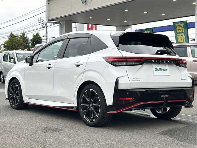 日産 オーラ ニスモ 愛媛県 2023(令5)年 0.3万km ピュアホワイトパール エマージェンシーブレーキ /プロパイロット /純正メモリナビ/　　BT/フルセグ/Apple CarPlay /アラウンドビューモニター /LEDオートライト /ハーフレザーシート /純正17インチアルミホイール /ワイヤレス充電 /インテリジェントミラー /純正ETC2.0