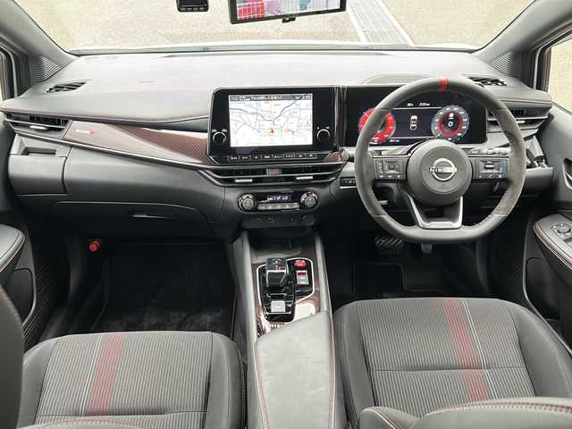 日産 オーラ ニスモ 愛媛県 2023(令5)年 0.3万km ピュアホワイトパール エマージェンシーブレーキ /プロパイロット /純正メモリナビ/　　BT/フルセグ/Apple CarPlay /アラウンドビューモニター /LEDオートライト /ハーフレザーシート /純正17インチアルミホイール /ワイヤレス充電 /インテリジェントミラー /純正ETC2.0