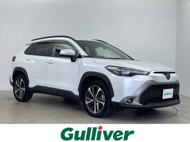 トヨタ カローラ クロス ハイブリッド Z 鹿児島県 2022(令4)年 3.5万km プラチナホワイトパールマイカ 純正9インチディスプレイオーディオ/パノラミックビューモニター/プリクラッシュセーフティ/レーンキープアシスト/レーダークルーズコントロール/電動リアゲート/ブラインドスポットモニター/ドライブレコーダー/ETC/AC100V/オートライト/ハーフレザーシート/シートヒーター/純正フロアマット/ドアバイザー/スマートキー/プッシュスタート