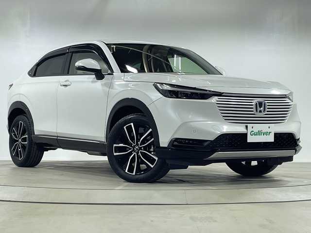 ホンダ ヴェゼル ハイブリッド e:HEV Z 神奈川県 2023(令5)年 1.6万km プラチナホワイトパール HondaCONNECT9インチディスプレイ/AM　FM　フルセグ　　USB　Bluetooth/バックカメラ/ハンズフリーパワーバックドア/ホンダセンシング/ブラインドスポットインフォメーション　後退出庫サポート/ETC2.0/社外ドライブレコーダー/革巻きステアリング/パドルシフト/ステアリングヒーター/ワイヤレス充電器/コンビシート/前席シートヒーター/後席用USBポート×2/トノカバー/ISOFIX対応/純正フロアマット/スマートキー/親水/ヒーテッドドアミラー/LEDヘッドライト/オートレベリング機構/LEDアクティブコーナーリングライト/シーケンシャルターンランプ/フォグランプ/純正18インチアルミ/ドアバイザー/衝突軽減ブレーキ/誤発進抑制機能/後方誤発進抑制機能/近距離衝突軽減ブレーキ/歩行者事故軽減ステアリング/路外逸脱抑制k脳/渋滞追従機能付アダプティブクルーズコントロール/車線維持支援システム/先行車発進お知らせ機能/標識認識機能/オートハイビーム/パーキングセンサーシステム