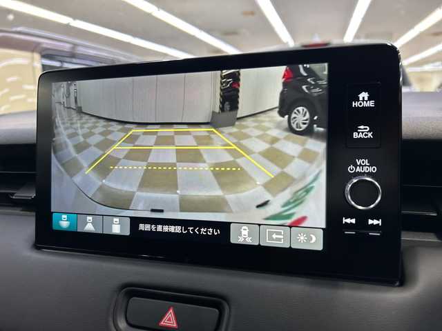 ホンダ ヴェゼル ハイブリッド e:HEV Z 神奈川県 2023(令5)年 1.6万km プラチナホワイトパール HondaCONNECT9インチディスプレイ/AM　FM　フルセグ　　USB　Bluetooth/バックカメラ/ハンズフリーパワーバックドア/ホンダセンシング/ブラインドスポットインフォメーション　後退出庫サポート/ETC2.0/社外ドライブレコーダー/革巻きステアリング/パドルシフト/ステアリングヒーター/ワイヤレス充電器/コンビシート/前席シートヒーター/後席用USBポート×2/トノカバー/ISOFIX対応/純正フロアマット/スマートキー/親水/ヒーテッドドアミラー/LEDヘッドライト/オートレベリング機構/LEDアクティブコーナーリングライト/シーケンシャルターンランプ/フォグランプ/純正18インチアルミ/ドアバイザー/衝突軽減ブレーキ/誤発進抑制機能/後方誤発進抑制機能/近距離衝突軽減ブレーキ/歩行者事故軽減ステアリング/路外逸脱抑制k脳/渋滞追従機能付アダプティブクルーズコントロール/車線維持支援システム/先行車発進お知らせ機能/標識認識機能/オートハイビーム/パーキングセンサーシステム