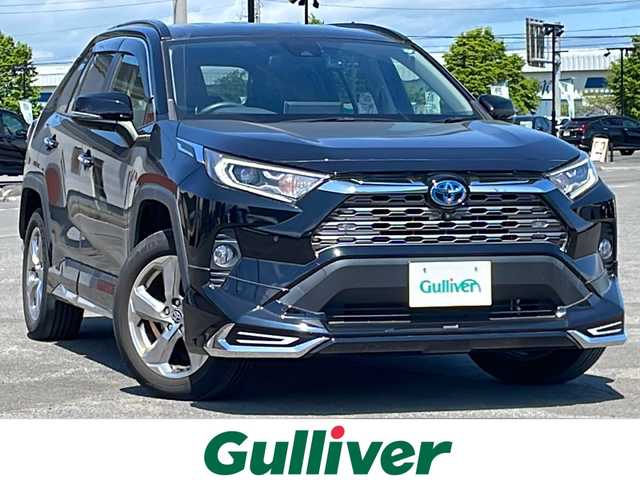 トヨタ ＲＡＶ４ ハイブリッドG 道央・札幌 2021(令3)年 3.1万km アティチュードブラックマイカ ４WD/モデリスタエアロ/純正ディーラーOPナビ/AM/FM/BT/フルセグ/トヨタセーフティセンス/プリクラッシュセーフティ/横滑り防止装置/レーダークルーズコントロール/レーンキープアシスト/クリアランスソナー/ブラインドスポットモニター/リアクロストラフィックアラート/パーキングサポートブレーキ/ロードサインアシスト/パノラミックビューモニター/ビルトインETC/ドライブレコーダー/自動防眩ミラー/EVMODE/DRIVEMODE切替/パワーバックドア/D席パワーシート/D席メモリーシート/前席シートヒーター/レザーシート/革巻きステアリング/ステアリングリモコン/ハンドルヒーター/AC100V/MTモード付AT/プッシュスタート/スマートキー/LEDヘッドライト/オートライト/オートハイビーム/フォグランプ/電動格納ミラー/ウィンカーミラー/純正フロアマット/ドアバイザー