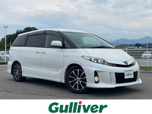 トヨタ エスティマ ハイブリッド アエラス プレミアムエディション 富山県 2014(平26)年 7.6万km ホワイトパールクリスタルシャイン 4WD/両側パワースライドドア　/純正７インチナビ(NHZD-W62G)　/(TV/CD/DVD/BTA.FM/AM)/クルーズコントロール　/パワーバックドア　/１００Ｖ電源　/バックカメラ　/パワーシート　/オットマン　/ドライブレコーダー　/純正ＥＴＣ　/オートライト　/純正ホイール/取扱説明書/ナビ取扱説明書