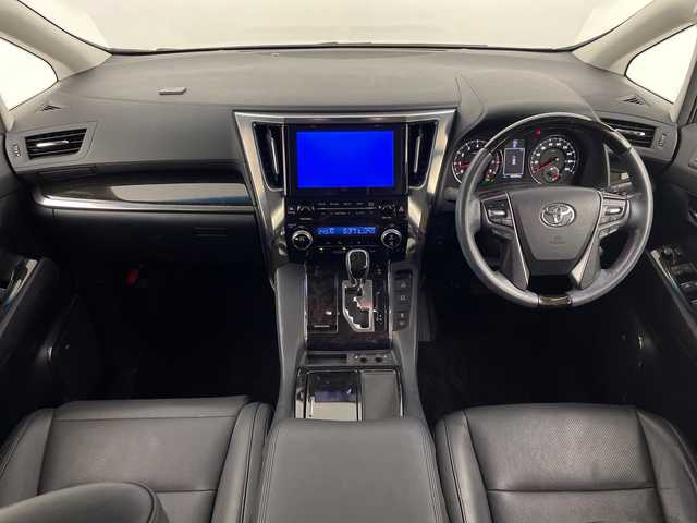 トヨタ ヴェルファイア ZA Gエディション 鹿児島県 2015(平27)年 4.1万km ホワイトパールクリスタルシャイン 純正ナビ/（フルセグ/Bluetooth/CD/DVD）/トヨタセーフティセンス/プリクラッシュセーフティ　/ＪＢＬプレミアムサウンド　/モデリスタエアロ　/純正フリップダウンモニター　/レーダークルーズコントロール/パノラミックビューモニター/両側パワースライドドア/前席シートヒーター/運転席パワーシート　/助手席パワーシート/純正ビルトインＥＴＣ/レザーシート/オットマンシート/レーンキープアシスト/バックカメラ/3列シート/電動リアゲート/ウォークスルー/純正18インチアルミホイール/オートマチックハイビーム/前後コーナーセンサー/保証書/取扱説明書/スペアキー