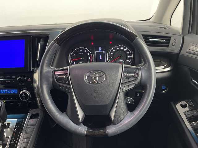 トヨタ ヴェルファイア ZA Gエディション 鹿児島県 2015(平27)年 4.1万km ホワイトパールクリスタルシャイン 純正ナビ/（フルセグ/Bluetooth/CD/DVD）/トヨタセーフティセンス/プリクラッシュセーフティ　/ＪＢＬプレミアムサウンド　/モデリスタエアロ　/純正フリップダウンモニター　/レーダークルーズコントロール/パノラミックビューモニター/両側パワースライドドア/前席シートヒーター/運転席パワーシート　/助手席パワーシート/純正ビルトインＥＴＣ/レザーシート/オットマンシート/レーンキープアシスト/バックカメラ/3列シート/電動リアゲート/ウォークスルー/純正18インチアルミホイール/オートマチックハイビーム/前後コーナーセンサー/保証書/取扱説明書/スペアキー