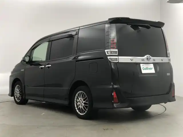 トヨタ ヴォクシー ハイブリッド ZS 煌Ⅱ 愛知県 2019(令1)年 6.6万km ブラック アルパイン11型ナビ/（Bluetooth/フルセグTV/CD/DVD/HDMI）/EX11Z/アルパイン１２．８型フリップダウンモニター/PXH12X-R/両側電動スライドドア/トヨタセーフティセンス/・プリクラッシュセーフティ/・レーンアシスト/・オートマチックハイビーム/前席シートヒーター/バック・サイド・フロントカメラ/HDMI/純正１６インチAW/205/55/R16/ドライブレコーダー/ZDR-015/純正LEDライト/クルーズコントロール/スマートキー/保証書/取扱説明書