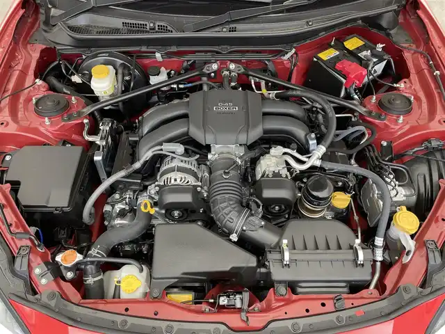 トヨタ ＧＲ８６ RZ 滋賀県 2024(令6)年 0.8万km 赤 禁煙車/純正ナビ/（CD/DVD/SD/Bluetooth/フルセグTV）/バックカメラ/前方ドライブレコーダー/ETC/Bremboキャリパー/車線逸脱警報/プリクラッシュブレーキ/後側方警戒支援システム/クリアランスソナー/ステアリング連動ヘッドランプ/パワーバックドア/ハーフレザーシート/前席シートヒーター/純正アルミホイール/純正フロアマット/USB充電/LEDヘッドライト/フォグランプ/オートヘッドライト/オートマチックハイビーム/ヘッドライトレベライザー/革巻きステアリング/追従型クルーズコントロール/ステアリングリモコン/スペアキー1本