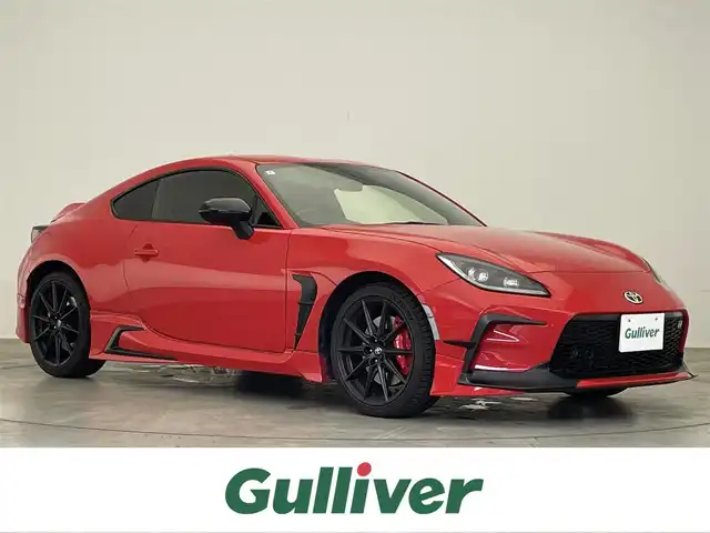 トヨタ ＧＲ８６ RZ 滋賀県 2024(令6)年 0.8万km 赤 禁煙車/純正ナビ/（CD/DVD/SD/Bluetooth/フルセグTV）/バックカメラ/前方ドライブレコーダー/ETC/Bremboキャリパー/車線逸脱警報/プリクラッシュブレーキ/後側方警戒支援システム/クリアランスソナー/ステアリング連動ヘッドランプ/パワーバックドア/ハーフレザーシート/前席シートヒーター/純正アルミホイール/純正フロアマット/USB充電/LEDヘッドライト/フォグランプ/オートヘッドライト/オートマチックハイビーム/ヘッドライトレベライザー/革巻きステアリング/追従型クルーズコントロール/ステアリングリモコン/スペアキー1本