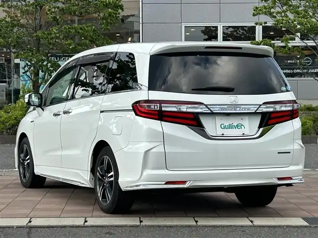 ホンダ オデッセイ ハイブリッド アブソルート ホンダセンシング 福島県 2016(平28)年 4.2万km ホワイトオーキッドパール Honda SENSING/・衝突軽減ブレーキ/・オートハイビーム/・誤発進抑制機能/・後方誤発進抑制機能/・路外逸脱警報機能/・アダプティブクルーズコントロール/・車線維持支援システム/・歩行者事故低減ステアリング/・先行車発進お知らせ機能/・標識認識機能/純正メモリナビ（VXM-165VFEi）/　【フルセグ/CD/DVD/MSV/BT/SD/HDMI/USB】/バックカメラ/ステアリングスイッチ/前席パワーシート/ハーフレザーシート/両側パワースライドドア/横滑り防止機能/衝突軽減システム/レーンキープアシスト/パーキングアシスト/コーナーセンサー/ビルトインETC/純正フロアマット/純正ドアバイザー