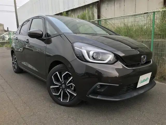 ホンダ フィット e:HEVホーム 富山県 2020(令2)年 4.3万km プレミアムグラマラスブロンズP 〇9インチ純正ナビ/〇フルセグTV/〇バックカメラ/〇ビルトインETC/〇ドライブレコーダー/〇ホンダセンシング/〇アダプティブクルーズコントロール/〇LEDヘッドランプ/〇オートライト/〇純正16インチアルミ/〇革巻きステアリング/〇スマートキーシステム/〇禁煙車