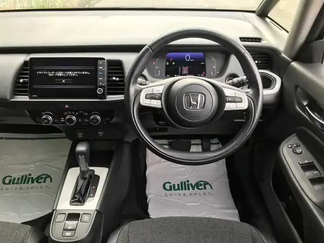 ホンダ フィット e:HEVホーム 富山県 2020(令2)年 4.3万km プレミアムグラマラスブロンズP 〇9インチ純正ナビ/〇フルセグTV/〇バックカメラ/〇ビルトインETC/〇ドライブレコーダー/〇ホンダセンシング/〇アダプティブクルーズコントロール/〇LEDヘッドランプ/〇オートライト/〇純正16インチアルミ/〇革巻きステアリング/〇スマートキーシステム/〇禁煙車