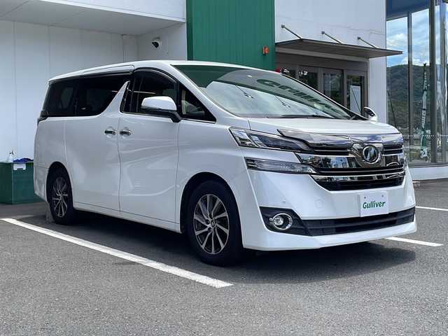 トヨタ ヴェルファイア V 京都府 2015(平27)年 6.6万km ホワイトパールクリスタルシャイン 純正９インチナビ　ＤＶＤ再生　Ｂｌｕｅｔｏｏｔｈオーディオ　フルセグ　バックカメラ　後席フリップダウンモニター　プリクラッシュセーフティ　レーダークルーズコントロール　両側パワースライド　ＬＥＤライト