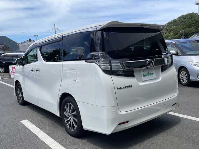 トヨタ ヴェルファイア V 京都府 2015(平27)年 6.6万km ホワイトパールクリスタルシャイン 純正９インチナビ　ＤＶＤ再生　Ｂｌｕｅｔｏｏｔｈオーディオ　フルセグ　バックカメラ　後席フリップダウンモニター　プリクラッシュセーフティ　レーダークルーズコントロール　両側パワースライド　ＬＥＤライト