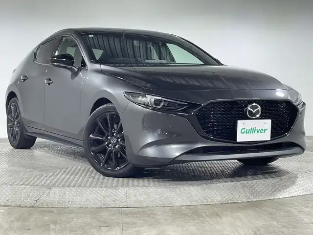マツダ マツダ３ファストバック 20S ブラックトーンED 神奈川県 2021(令3)年 1.7万km マシーングレープレミアムM 純正8.8インチSDナビ/CD&DVD&BT&USB&HDMI&フルセグTV/バックカメラ/スマートブレーキサポート/AT誤発進抑制制御/レーダークルーズコントロール/クルージングトラフィックサポート/車線逸脱警報システム/レーンキープアシスト/前後側方接近車両検知/ブラインドスポットモニタリング/フロントパーキングセンサー/リアパーキングセンサー/ドライバーアテンションアラート/純正ドライブレコーダー/ビルトインETC/パドルシフト/自動防眩ミラー/アイドリングストップ/電動パーキングブレーキ/ブレーキオートホールド/LEDヘッドライト/オートハイビーム