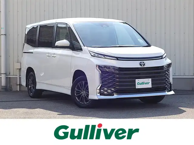 トヨタ ヴォクシー S－Z 山形県 2023(令5)年 1.3万km ホワイトパールクリスタルシャイン 4WD/衝突被害軽減システム/純正ディスプレイオーディオ/　　【BT USB AM・FM Miracast】/バックカメラ/両側パワースライドドア/レーダークルーズコントロール/LEDオートヘッドライト/ハーフレザーシート/シートヒーター/純正16インチアルミホイール/コーナーセンサー/ステアリングスイッチ/MTモード付AT/電動格納ウィンカーミラー/スマートキー/ETC