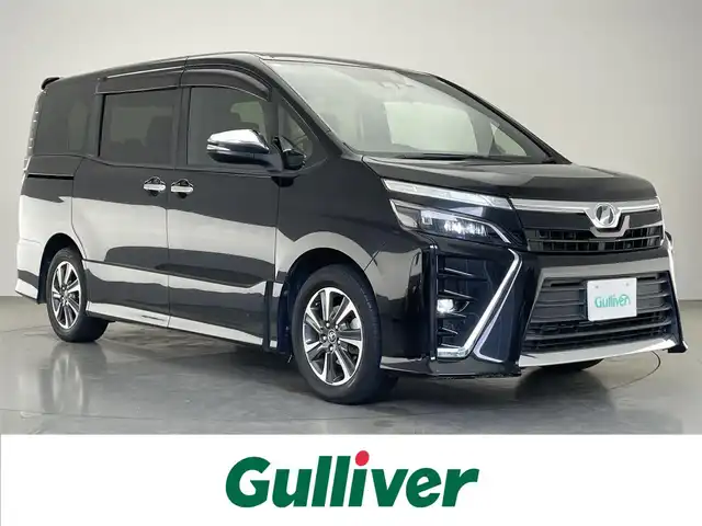 トヨタ ヴォクシー ZS 煌 愛知県 2018(平30)年 8.7万km ブラック 純正９型ナビ　純正１２．１型後席モニター　禁煙車　後席エアコン　ＥＴＣ　ドラレコ　バックカメラ　両側パワースライドドア　セーフティセンス　衝突軽減　レーンキープ　オートハイビーム　クルーズコントロール