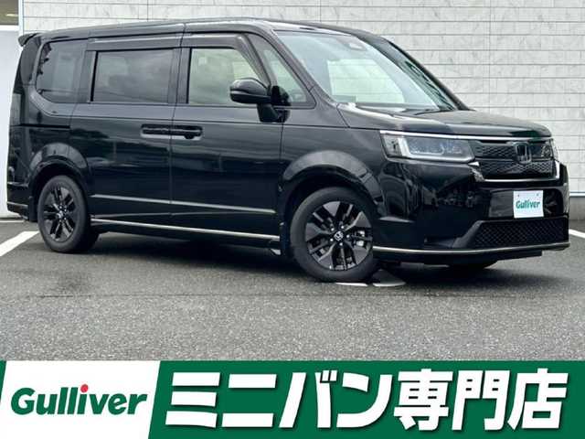 ホンダ ステップワゴン スパーダ eHEV 福岡県 2022(令4)年 1万km クリスタルブラックパール 純正11.4型SDナビ（フルセグTV/CD/DVD/BT）バックモニターホンダセンシングコーナーセンサーレーダークルコン両側パワスラ前後ドラレコシートヒーターオットマンUSBポート純正LEDヘッドライト純正16インチアルミホイル純正フロアマットプッシュスタートスマートキー