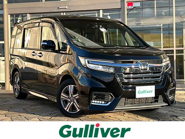 ホンダ ステップワゴン スパーダ ハイブリッド G EX ホンダセンシング 静岡県 2017(平29)年 9.7万km プレミアムスパークルブラックパール 純正メモリナビ/・CD/・DVD/・フルセグＴＶ/・Bluetooth/・USB/・AM/・FM/主要装備/・両側パワスラ/・後席モニター/・ホンダセンシング/・衝突軽減/・レーンキープ/・追従クルコン/・全方位カメラ/・ビルトインETC/・ドラレコ前後/・ハーフレザーシート/・シートヒーターD/N席/・電動パーキングブレーキ/・オートホールド/・純正フロアマット/・純正アルミホイール/・LEDヘッドライト/・オートライト/・ステリモ