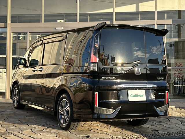 ホンダ ステップワゴン スパーダ ハイブリッド G EX ホンダセンシング 静岡県 2017(平29)年 9.7万km プレミアムスパークルブラックパール 純正メモリナビ/・CD/・DVD/・フルセグＴＶ/・Bluetooth/・USB/・AM/・FM/主要装備/・両側パワスラ/・後席モニター/・ホンダセンシング/・衝突軽減/・レーンキープ/・追従クルコン/・全方位カメラ/・ビルトインETC/・ドラレコ前後/・ハーフレザーシート/・シートヒーターD/N席/・電動パーキングブレーキ/・オートホールド/・純正フロアマット/・純正アルミホイール/・LEDヘッドライト/・オートライト/・ステリモ