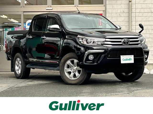トヨタ ハイラックス Z 岩手県 2018(平30)年 1.9万km アティチュードブラックマイカ ・4WD/・純正ナビ（NSZT-W66T）/・フルセグ/・AM/FM/CD/Bluetooth/・プッシュスタート/・スマートキー/・スペアキー1本/・Toyota Safety Sense/・横滑り防止/・オートライト/・LEDヘットライト/・レーダークルーズコントロール/・ダウンヒルアシストコントロール/・MTモード付AT/・純正ETC/・純正フロアマット/・純正ドアバイザー/・純正AW/・ハードノトカバー/・純正ダンパー/・サマータイヤ純正AWセット積み/・保証書/・取扱説明書