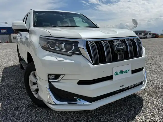 トヨタ ランドクルーザー プラド TX 富山県 2017(平29)年 7.5万km ホワイトパールクリスタルシャイン 〇モデリスタエアロ/〇ムーンルーフ/〇純正8インチナビ/〇フルセグTV/〇バックカメラ/〇パノラマモニター/〇ビルトインETC/〇7人乗り/〇セーフティセンスP/・レーダークルーズコントロール/・プリクラッシュセーフティーシステム/・レーンディパーチャーアラート/・オートマチックハイビーム/〇トラクションコントロール/〇ヒルスタートアシストコントロール/〇LEDヘッドランプ/〇オートライト/〇LEDフロントフォグランプ/〇純正17インチアルミ/〇左右独立温度調整機能付オートエアコン/〇スマートエントリー/スタートシステム/〇禁煙車
