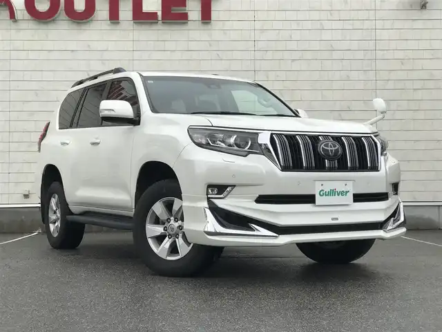 トヨタ ランドクルーザー プラド TX 富山県 2017(平29)年 7.5万km ホワイトパールクリスタルシャイン 〇モデリスタエアロ/〇ムーンルーフ/〇純正8インチナビ/〇フルセグTV/〇バックカメラ/〇パノラマモニター/〇ビルトインETC/〇7人乗り/〇セーフティセンスP/・レーダークルーズコントロール/・プリクラッシュセーフティーシステム/・レーンディパーチャーアラート/・オートマチックハイビーム/〇トラクションコントロール/〇ヒルスタートアシストコントロール/〇LEDヘッドランプ/〇オートライト/〇LEDフロントフォグランプ/〇純正17インチアルミ/〇左右独立温度調整機能付オートエアコン/〇スマートエントリー/スタートシステム/〇禁煙車