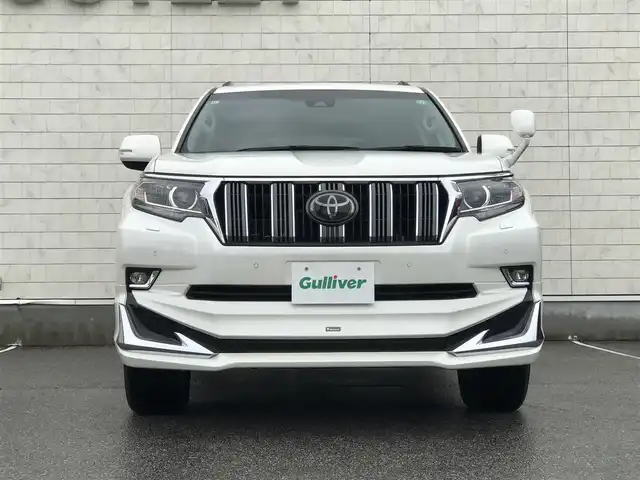 トヨタ ランドクルーザー プラド TX 富山県 2017(平29)年 7.5万km ホワイトパールクリスタルシャイン 〇モデリスタエアロ/〇ムーンルーフ/〇純正8インチナビ/〇フルセグTV/〇バックカメラ/〇パノラマモニター/〇ビルトインETC/〇7人乗り/〇セーフティセンスP/・レーダークルーズコントロール/・プリクラッシュセーフティーシステム/・レーンディパーチャーアラート/・オートマチックハイビーム/〇トラクションコントロール/〇ヒルスタートアシストコントロール/〇LEDヘッドランプ/〇オートライト/〇LEDフロントフォグランプ/〇純正17インチアルミ/〇左右独立温度調整機能付オートエアコン/〇スマートエントリー/スタートシステム/〇禁煙車