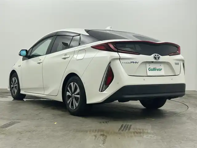 トヨタ プリウス ＰＨＶ A プレミアム 岡山県 2019(平31)年 4.6万km ホワイトパールクリスタルシャイン 純正１１．４インチナビ　/（フルセグTV/Bluetooth/AUX）		/バックカメラ　/黒レザー　/レーダークルーズコントロール　/衝突軽減ブレーキ　/ビルトインＥＴＣ２．０　/ＬＥＤヘッドライト　/ヘッドアップディスプレイ　/ブラインドスポットモニター/前席シートヒーター/シンプルインテリジェントパーキングアシスト/社外ドライブレコーダー/オートハイビーム
