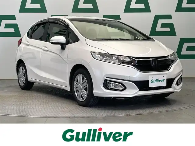 ホンダ フィット 13G L ホンダセンシング 鹿児島県 2018(平30)年 6.2万km プラチナホワイトパール 禁煙　/ホンダセンシング　/○衝突軽減ブレーキ　/○誤発進抑制機能　/○車線維持支援システム/○先行車発進お知らせ機能/○標識認識機能/ディスプレイオーディオ　/バックカメラ　/追従型クルーズコントロール　/前後ドライブレコーダー　/純正ドアバイザー　/純正フロアマット　/ＥＴＣ　/ＬＥＤヘッドライト/オートライト