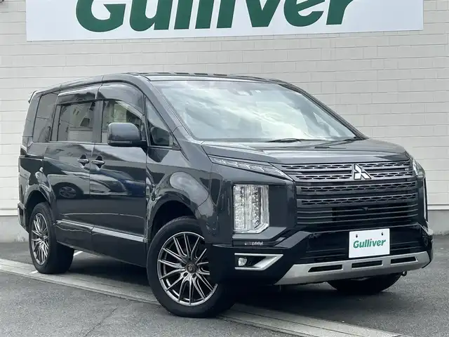三菱 デリカＤ：５ ジャスパー 静岡県 2023(令5)年 5.6万km グラファイトグレーメタリック/ブラックマイカ ●社外ナビ/（フルセグ/CD/DVD/Bluetooth）/(19AVNJ)/●全方位カメラ/●12.8インチ社外フリップダウンモニター/●アダプティブクルーズコントロール/●三菱E-ASSIST/●レーンキープアシスト/●ブラインドスポットモニター/●後側方車両検知警報システム/●オートブレーキホールド/●電動サイドパーキング/●LEDヘッドライト/●オートライト/●オートマチックハイビーム/●フォグランプ/●革巻きステアリング/●ステアリングスイッチ/●パドルシフト/●ステアリングヒーター/●電動格納ウインカーミラー/●ETC/●運転席パワーシート/●運転席＆助手席シートヒーター/●純正フロアマット/●ドアバイザー/●前後ドライブレコーダー/●電動サイドステップ/●自動防眩ミラー/●ISOFIX/●プッシュスタート/●スマートキー/●社外18インチアルミホイール/●W+サイド+ニー+カーテンSRS+ABS/●保証書/●取扱説明書