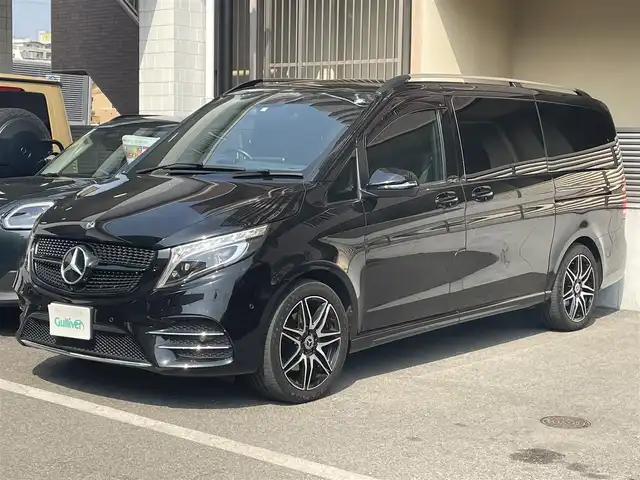 メルセデス・ベンツ Ｍ・ベンツ Ｖ２２０ d AVG ロング AMGライン 大阪府 2021(令3)年 2.7万km オブシディアンブラックM [AMGライン】/・AMGデザインエクステリア/（フロントバンパー・フロントグリル・サイドスカート・リアルーフスポイラーリップ）/・19インチAMG7ツインスポークアルミホイール/・カーボン調インテリアトリム/・ステンレスアクセル＆ブレーキペダル（ラバースタッド付）/・パノラミックスライディングルーフ（挟み込み防止機能付）/【エクスクルーシブシートパッケージ】/・2列目エクスクルーシブシート（本革）/・シートヒーター/・シートベンチレーター/・メモリー付パワーシート/・リラクゼーション機能オットマン/フットレスト/ヘッドレストクッション/・3列目ベンチシート/ETC2.0/リアエンターテイメント（TVM-PW1000）/　HDMI/アラウンドビューモニター/Burmesterサウンド/純正ナビ/　フルセグTV/FM/AM/Bluetooth/USB/アクティブブレーキアシスト/　ブラインドスポットアシスト/　アテンションアシスト/　レーンキープアシスト/　インテリジェントライトシステム/ステアリングスイッチ/アンビエントライトロケイターライティング/置くだけ充電/ISOFIX/パドルシフト/オートライト/両側パワースライドドア