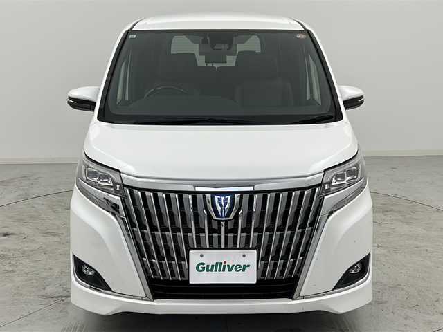トヨタ エスクァイア ハイブリッド Gi プレミアムパッケージ 宮城県 2017(平29)年 11.8万km ホワイトパールクリスタルシャイン 禁煙車/フリップダウンモニター/トヨタセーフティセンス/・プリクラッシュセーフティ/・レーンディパーチャーアラート/・オートマチックハイビーム/・レーダークルーズコントロール/純正9インチSDナビ/・BT/AM/FM/CD/SD/フルセグTV /バックカメラ/両側パワースライドドア/前席シートヒーター/ビルトインETC/革巻きステアリング/ステアリングヒーター/プッシュスタート/スマートキー×2/LEDヘッドライト/LEDフォグランプ/社外15インチアルミホイール/積み込み純正アルミホイール付き夏タイヤ/（195/65R15）/純正フロアマット/純正ドアバイザー