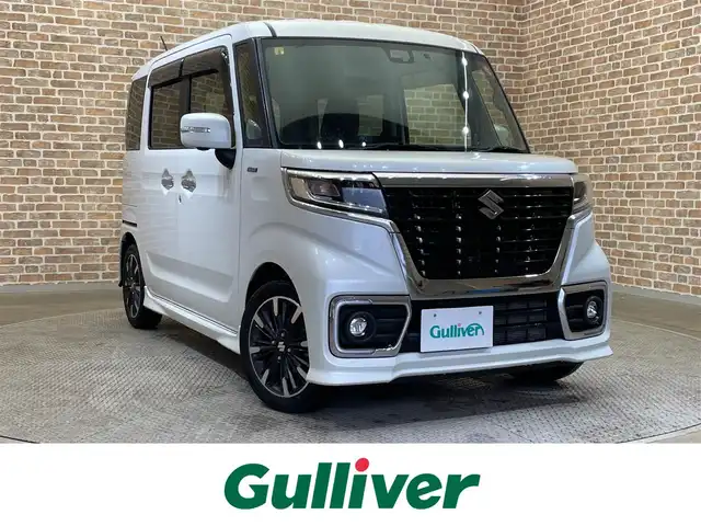 スズキ スペーシア カスタム HYBRID XS 岩手県 2018(平30)年 2.7万km ピュアホワイトP ４WD/ワンオーナー/全方位モニター/ヘッドアップディスプレイ/両側パワースライドドア/シートヒーター/スズキセーフティサポート/デュアルセンサーブレーキサポート/車線逸脱警報/リヤパーキングセンサー/先行車発進お知らせ/進入禁止標識表示機能/オートハイビーム/LEDヘッドライト/横滑り防止装置/スリムサーキュレーター/ロールサンシェード/シートバックテーブル/純正ナビ（Bluetooth CD DVD SD フルセグ USB）/純正１５インチアルミホイール