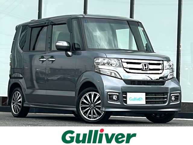 ホンダ Ｎ ＢＯＸ カスタム G ターボ Lパッケージ 山形県 2017(平29)年 6.5万km シャイニンググレーM 4WD/ホンダセーフティセンス/社外SDナビ/（Bluetooth/CD/DVD/ワンセグ)/両側パワースライドドア/ステアリングスイッチ/DN席シートヒーター/ハーフレザー/パドルシフト/ビルトインETC/ドライブレコーダー/純正アルミホイール/純正フロアマット/オートライト/電動格納ミラー/ウィンカーミラー/スマートキー/ドアバイザー