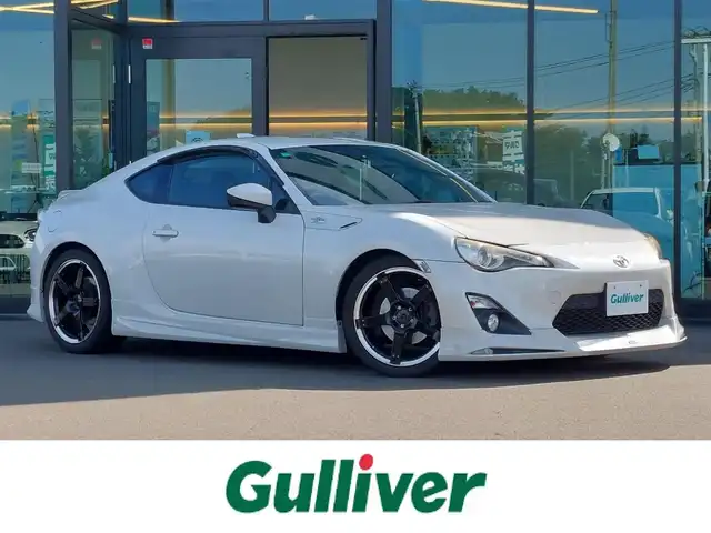 トヨタ ８６ GT リミテッド 東京都 2012(平24)年 3.9万km サテンホワイトパール モデリスタエアロ/トラスト GReddy車高調/社外18インチアルミホイール/純正ナビ/フルセグTV/ETC/ドライブレコーダー/プッシュスタート/パドルシフト/ハーフレザーシート/シートヒーター/HIDヘッドライト/オートライト/スマートキー