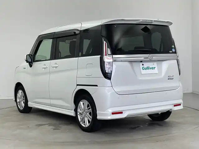 スズキ ソリオ HV MZ 新潟県 2021(令3)年 6万km ピュアホワイトP 純正メモリナビ/（BT/FM/AM/フルセグTV/DVD)/全周囲カメラ/衝突軽減ブレーキ/レーダークルーズコントロール/ステアリングスイッチ/シートヒーター/両側パワースライド/ヘッドアップディスプレイ/純正15インチアルミホイール/純正フロアマット/純正オートヘッドライト/電格ミラー/サンシェード/ETC