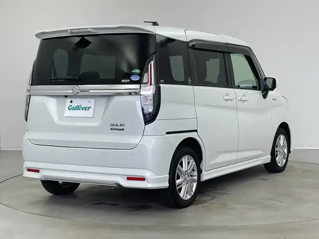 スズキ ソリオ HV MZ 新潟県 2021(令3)年 6万km ピュアホワイトP 純正メモリナビ/（BT/FM/AM/フルセグTV/DVD)/全周囲カメラ/衝突軽減ブレーキ/レーダークルーズコントロール/ステアリングスイッチ/シートヒーター/両側パワースライド/ヘッドアップディスプレイ/純正15インチアルミホイール/純正フロアマット/純正オートヘッドライト/電格ミラー/サンシェード/ETC