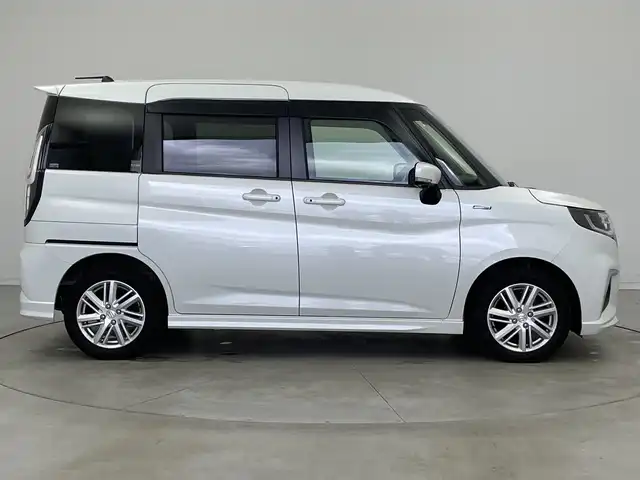 スズキ ソリオ HV MZ 新潟県 2021(令3)年 6万km ピュアホワイトP 純正メモリナビ/（BT/FM/AM/フルセグTV/DVD)/全周囲カメラ/衝突軽減ブレーキ/レーダークルーズコントロール/ステアリングスイッチ/シートヒーター/両側パワースライド/ヘッドアップディスプレイ/純正15インチアルミホイール/純正フロアマット/純正オートヘッドライト/電格ミラー/サンシェード/ETC