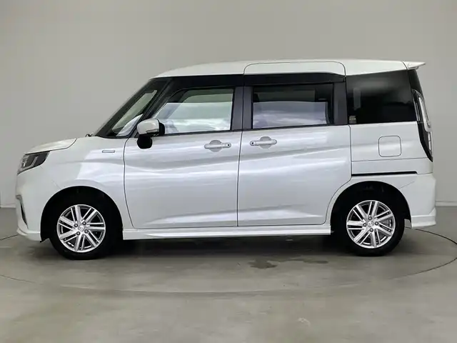 スズキ ソリオ HV MZ 新潟県 2021(令3)年 6万km ピュアホワイトP 純正メモリナビ/（BT/FM/AM/フルセグTV/DVD)/全周囲カメラ/衝突軽減ブレーキ/レーダークルーズコントロール/ステアリングスイッチ/シートヒーター/両側パワースライド/ヘッドアップディスプレイ/純正15インチアルミホイール/純正フロアマット/純正オートヘッドライト/電格ミラー/サンシェード/ETC