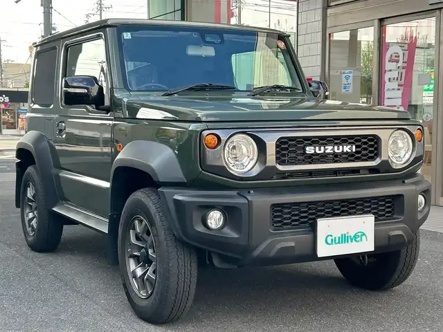 スズキ ジムニー シエラ JC 愛知県 2024(令6)年 4.6万km ジャングルグリーン ワンオーナー/純正SDナビ〈SKX-S808〉/DVD／Bluetooth／地デジTV/バックカメラ/前席シートヒーター/LEDヘッドライト/フロントフォグランプ/アイドリングストップ/ビルトインETC/純正15インチAW/ヘッドライトウォッシャー/スマートキー＆プッシュスタート/スズキセーフティサポート/・前方衝突被害軽減ブレーキアシスト/・デュアルセンサーブレーキサポート/・誤発信抑制機能/・車線逸脱警報/・ふらつき警報/・標識認識機能/・ハイビームアシスト
