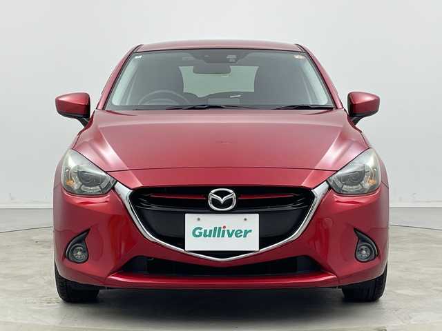 マツダ デミオ XD ツーリング 新潟県 2016(平28)年 5万km ソウルレッドプレミアムメタリック マツダコネクトナビ/　フルセグTV/Bluetooth/CD/DVD/衝突被害軽減ブレーキ/クルーズコントロール/前席シートヒーター/前後ドライブレコーダー/バックモニター/ビルトインETC/LEDヘッドライト/アイドリングストップ/横滑り防止装置/パドルシフト/レザーステアリング/ステアリングスイッチ/オートライト/純正16インチアルミホイール/スマートキー/純正フロアマット