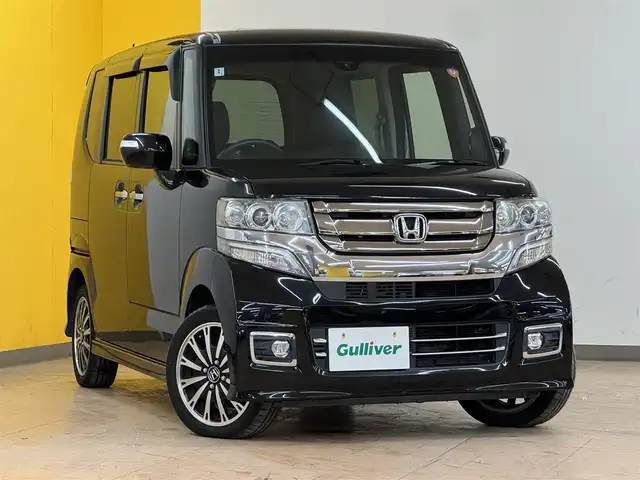ホンダ Ｎ ＢＯＸ カスタム G ターボ Lパッケージ 群馬県 2016(平28)年 9.6万km スマートブラック ホンダセンシング/・衝突軽減ブレーキ/・クルーズコントロール/・オートライト/・横滑り防止/純正8インチナビ/・AM/FM/フルセグTV/・Bluetooth/MSV/・SD/CD/DVD/バックカメラ/4WD/両側電動スライドドア/前席シートヒーター/純正フロアマット/純正ドアバイザー/スマートキー/プッシュスタート