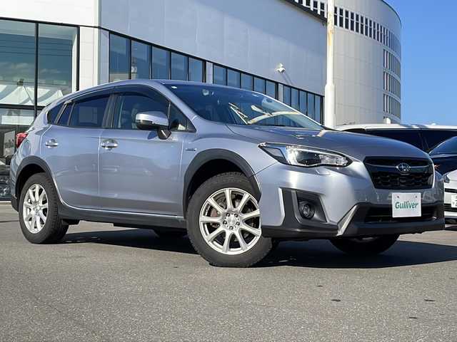 スバル ＸＶ ハイブリッド 2．0e－L アイサイト 青森県 2020(令2)年 6.8万km アイスシルバーメタリック ・4WD/・衝突軽減ブレーキ/・レーダークルーズコントロール/・レーンキープアシスト/・社外SDナビ/・Bluetooth/・バックカメラ/・ETC/・ステアリングスイッチ/・プッシュスタート/・スマートキー/・パドルシフト/・オートライト/・純正LEDヘッドライト/・純正フォグライト/・純正フロアマット/・社外17AW/・保証書あり