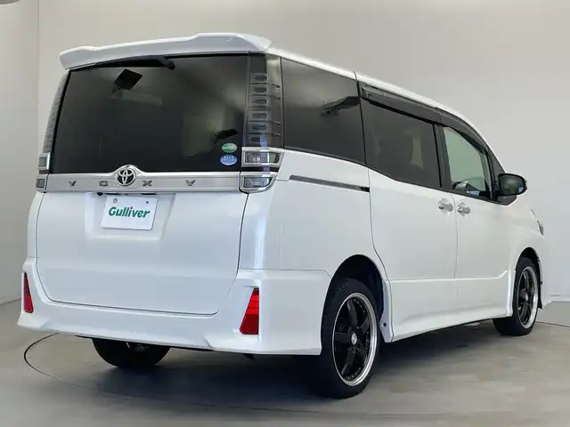 トヨタ ヴォクシー ZS 煌 新潟県 2019(平31)年 7.4万km ホワイトパールクリスタルシャイン 社外ナビ/バックカメラ/Bluetooth/CD/DVD/AUX/革巻きステアリング/HDMI/フルセグTV/ETC/両側パワースライドドア/ウォークスルー/LEDヘッドライト/プッシュスタート/スペアキー