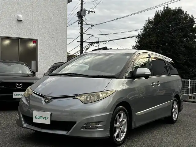 トヨタ エスティマ アエラス Gエディション NAVI 熊本県 2007(平19)年 14.4万km ミディアムシルバーメタリック ワンオーナー/純正メーカーナビ/【CD/DVD/ミュージックサーバー】/バックカメラ/両側パワースライドドア/ステアリングスイッチ/純正17インチAW/M/Tモード/オートライト/Wエアコン/ETC/純正フロアマット/プッシュスタート/スマートキー/ウォークスルー/3列シート/ウインカーミラー/ドアバイザー/記録簿
