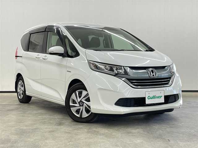 ホンダ フリード ハイブリット G ホンダセンシング 長崎県 2017(平29)年 5.7万km ホワイトオーキッドパール 純正9インチナビ　（VXM-175VFNi）/・フルセグTV　CD/DVD/SD/Bluetooth/ホンダセンシング/衝突軽減ブレーキ/レーンキープアシスト/横滑り防止/アダプティブクルーズコントロール/バックカメラ/ステアリングスイッチ/両側パワースライドドア/プッシュスタート/前後ドライブレコーダー/ETC/純正フロアマット/純正15インチホイールキャップ